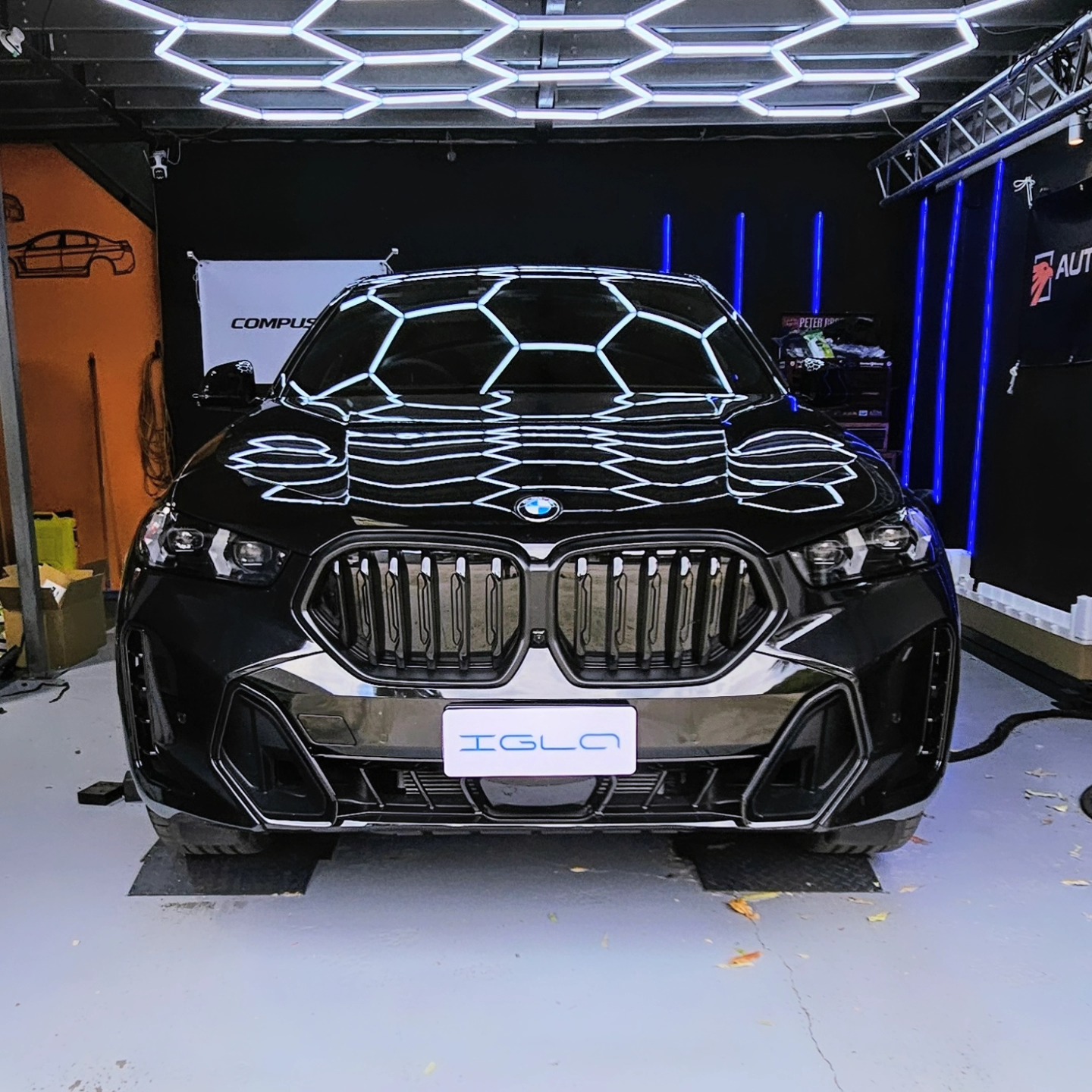 BMW X6 M front-end under the workshop honeycomb lighting at Euro Chiptuning Solutions
