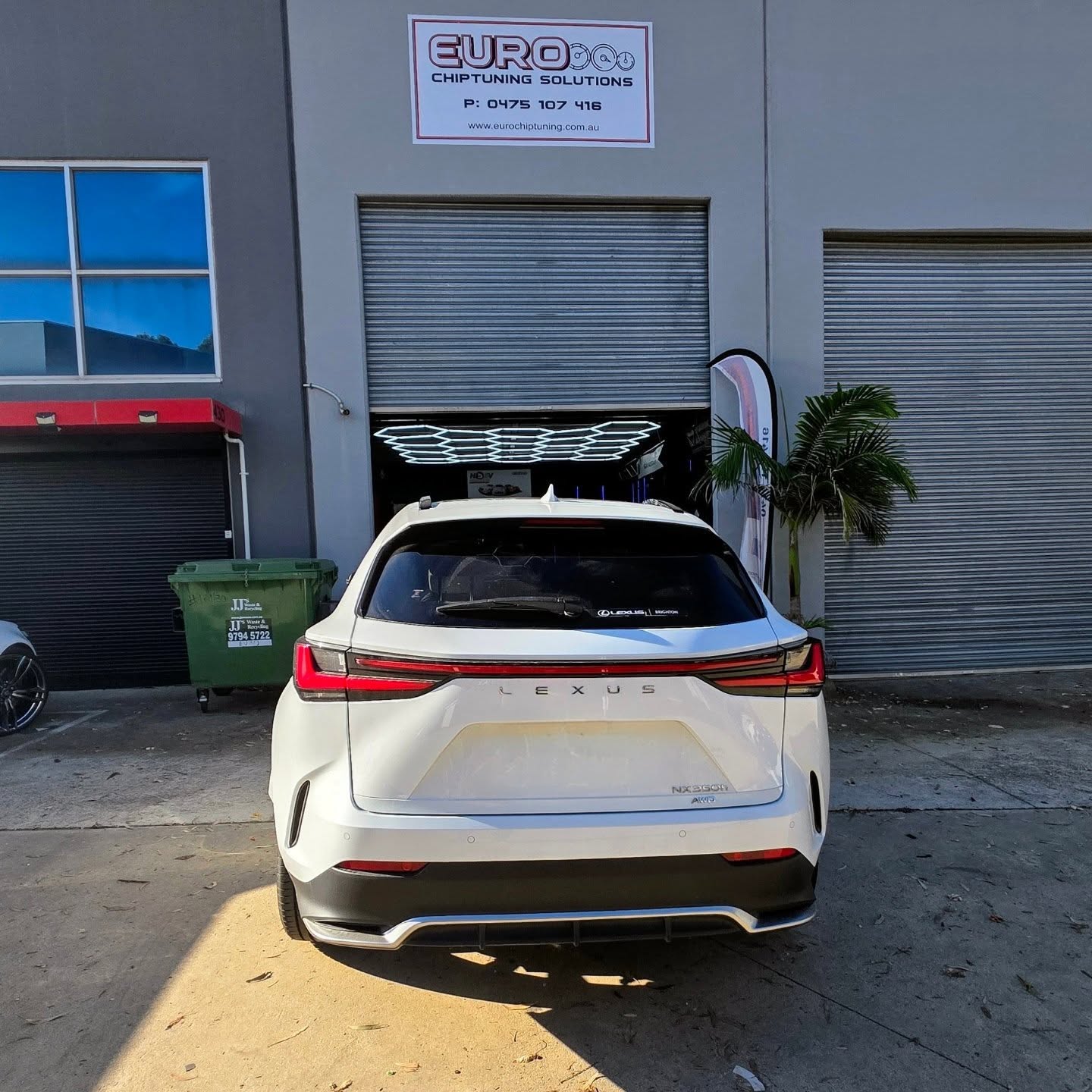 White Lexus NX 350h at the Euro Chiptuning Solutions workshop entrance