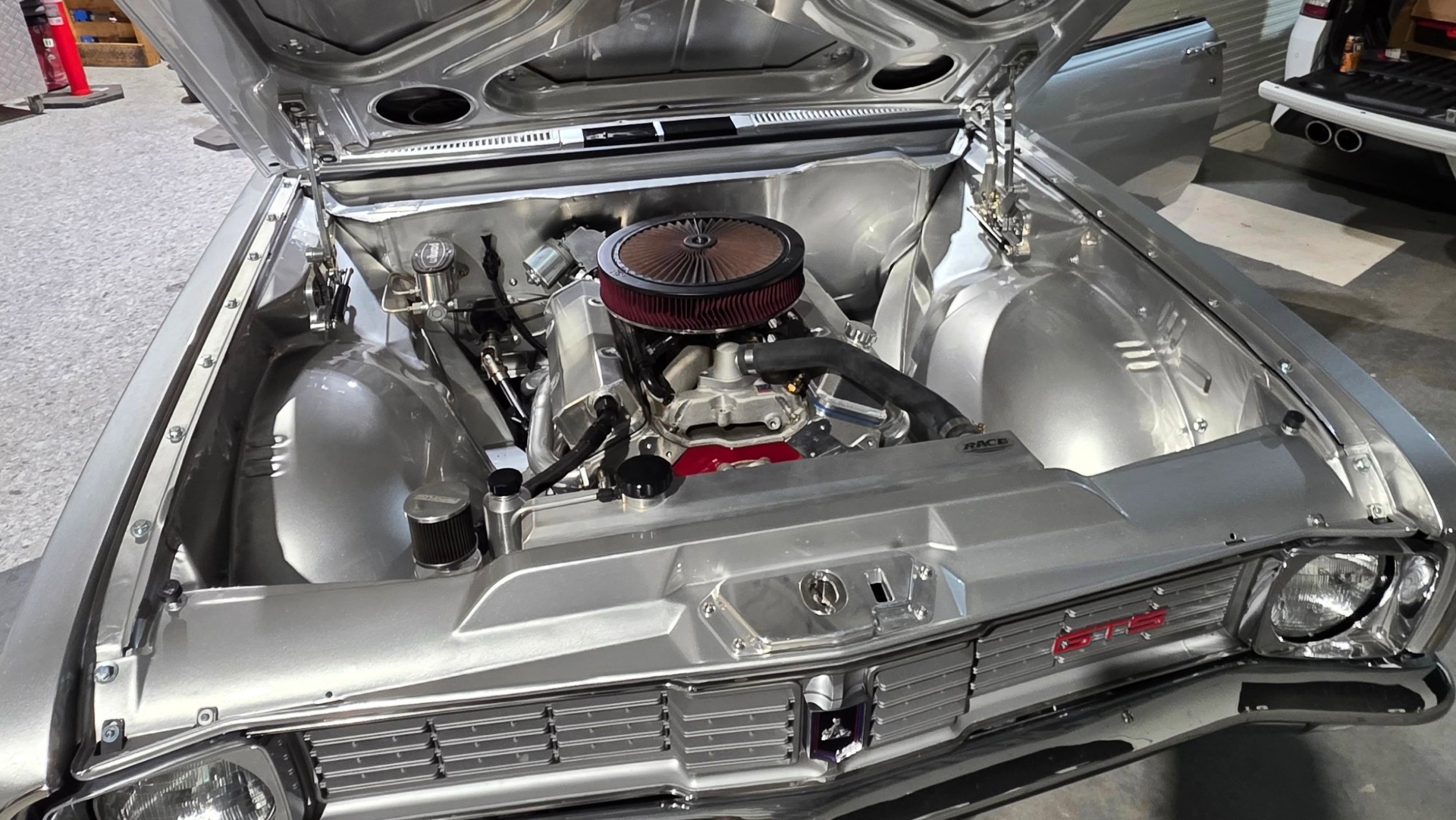 Polished V8 engine bay of a customer Holden Monaro