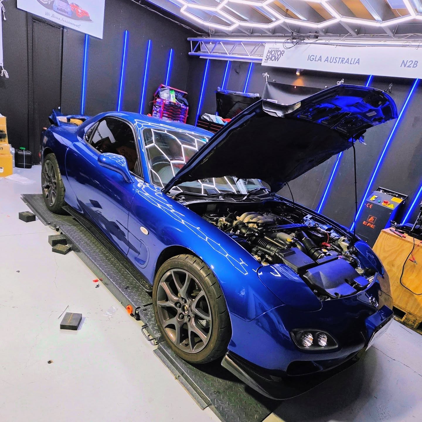 Blue Mazda RX-7 on the dyno with bonnet up at Euro Chiptuning Solutions