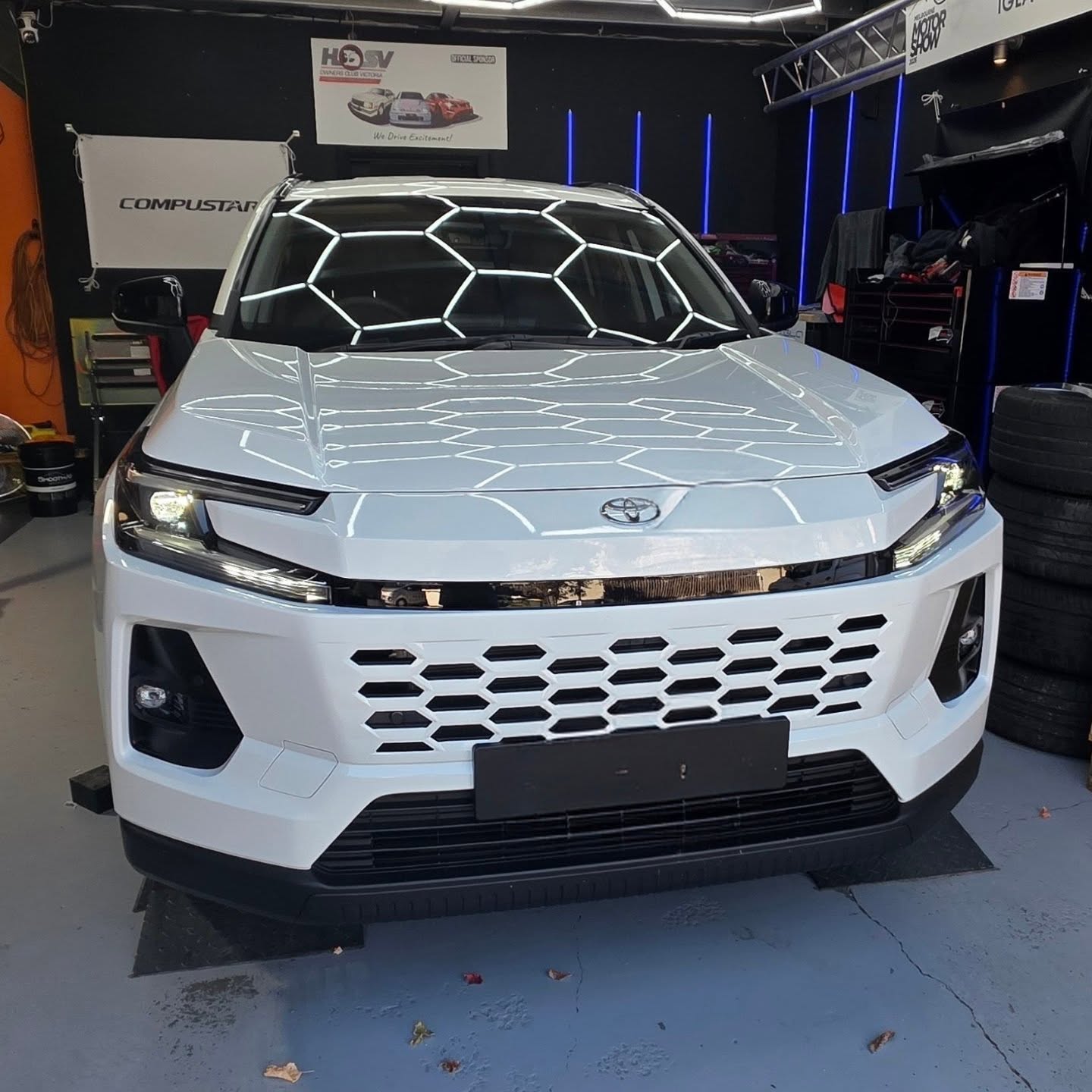 White Toyota SUV under the workshop hex lighting at Euro Chiptuning Solutions